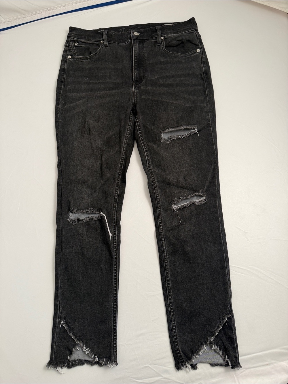 Free People We The Free high rise crossover tulip hem distressed black jeans